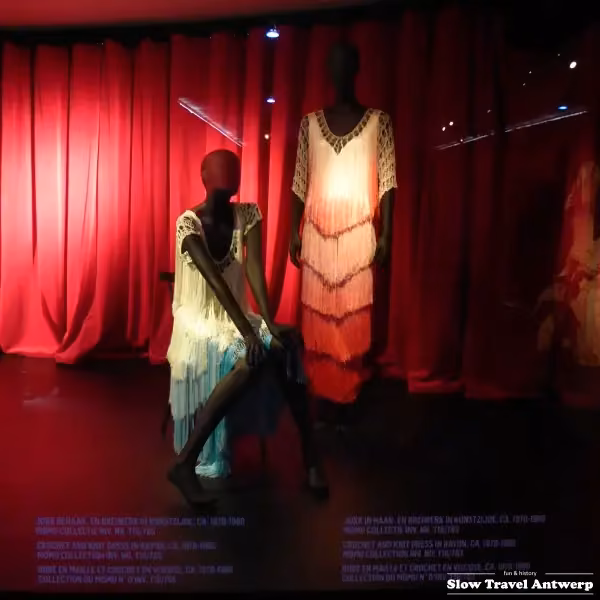 Pink and red fringed stage dress, at right — Ann Salens, Date not stated; exhibited 2017